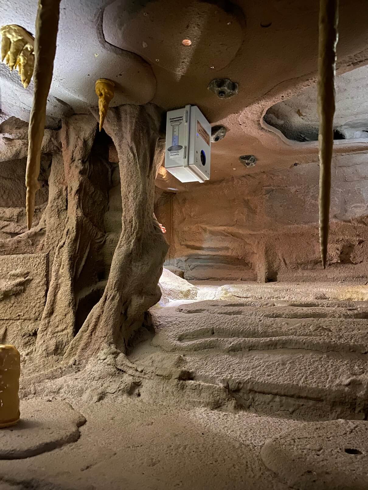 Cameras are hidden in realistic objects like in-cave temperature and humidity monitoring equipment (the white box).